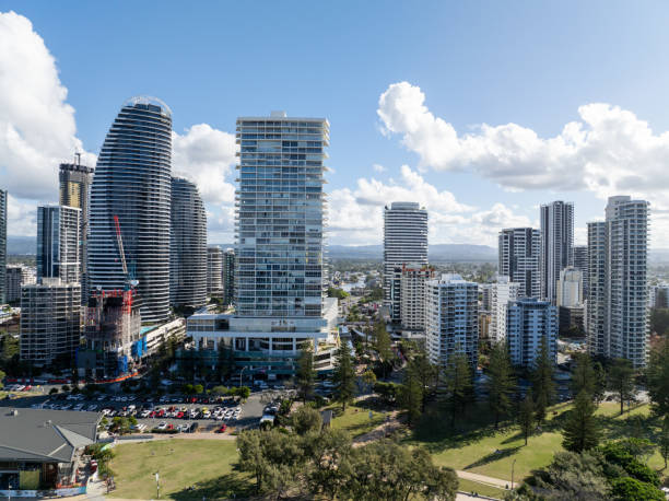 Explore the breathtaking aerial view of the Gold Coast and the financial district with skyscrapers in Queensland, Australia. This stunning image captures the vibrant coastal city, blending natural beauty with urban sophistication.