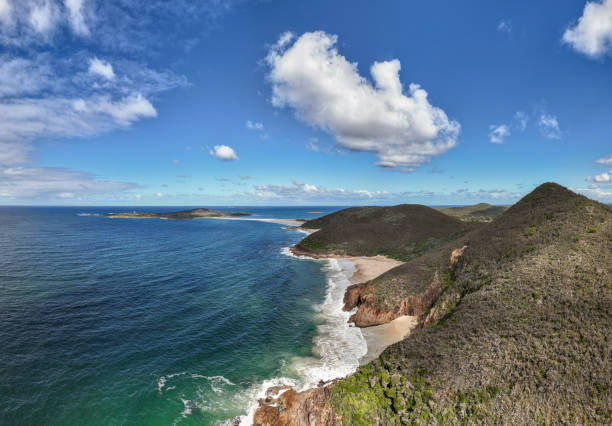 Experience the dramatic beauty of the world-famous Zenith Beach at Port Stephens peninsula, New South Wales, Australia, in this stunning aerial picture. The pristine coastline and turquoise waters create a breathtaking coastal paradise for beach lovers and adventurers.