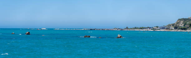 Discover the breathtaking coastline of Kaikoura, New Zealand, where stunning landscapes meet the majestic ocean, creating a captivating natural wonder.