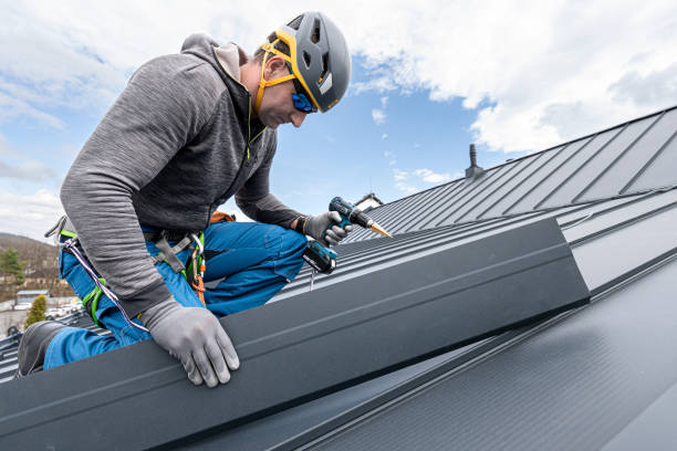 istock Work at heights. A tinman with climbing harness on the roof is working with a cordless drill on the sheeting. 2157298375