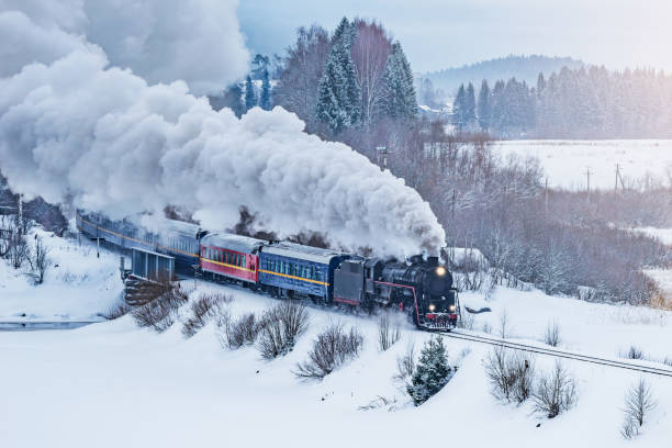istock Retro steam train moves at winter morning time 2157303048