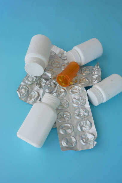 Close up of pills of blister pack on table .