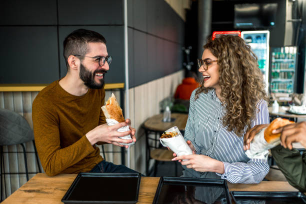 istock Couple eating in fast food restaurant 2157303419