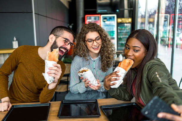 istock Friends taking selfies in fast food restaurant 2157303977