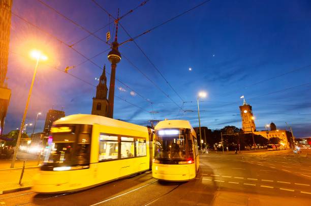 istock In Berlin’s early dawn, trams intersect under the towering TV Tower, while the sky’s dawn palette heralds the day’s start. This snapshot of movement and stillness encapsulates the city’s pulse amidst its historic silhouette. 2157304707