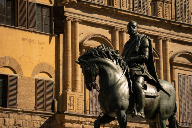 A powerful representation of Cosimo I de' Medici on horseback stands in the historic Piazza della Signoria in Florence, Italy