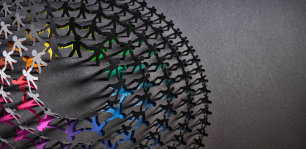 istock Abstract paper art sculpture with interconnected colorful figures casting intricate shadows on a dark background, showcasing creativity and unity. 2157307182
