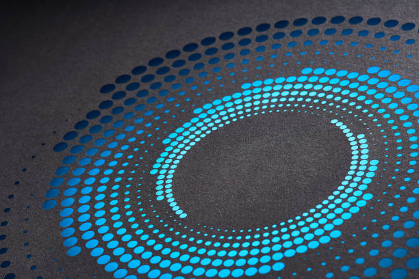 istock Circular paper art design with vibrant blue perforated dots on dark background, creating an eye-catching optical illusion. 2157307311