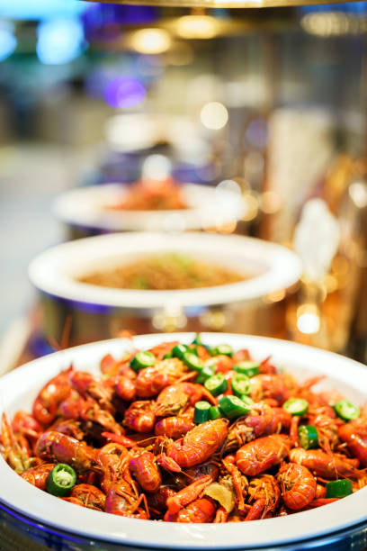A plate of spicy boiled crawfish and lobster salad