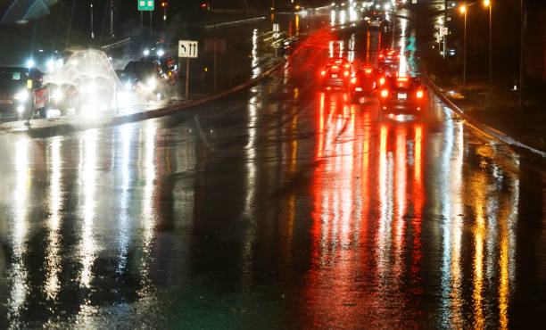 istock street night view in rain through car window 2157308169