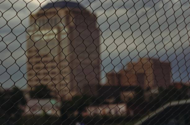 Picture of Colorado Springs behind a fence during dusk hours