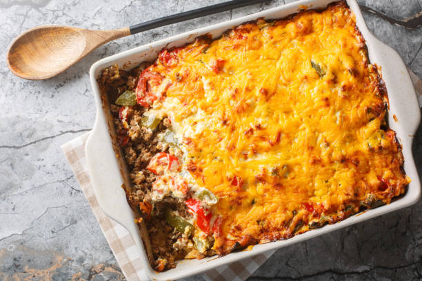 istock Classic John Wayne casserole has wonderfully southwest flavors, ground beef, a biscuit crust, fresh tomatoes, and a cheesy creamy topping closeup. Horizontal top view 2157318778