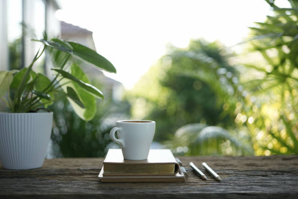 istock small white cup and notebook and plant pot balcony outdoor chilling 2157319136