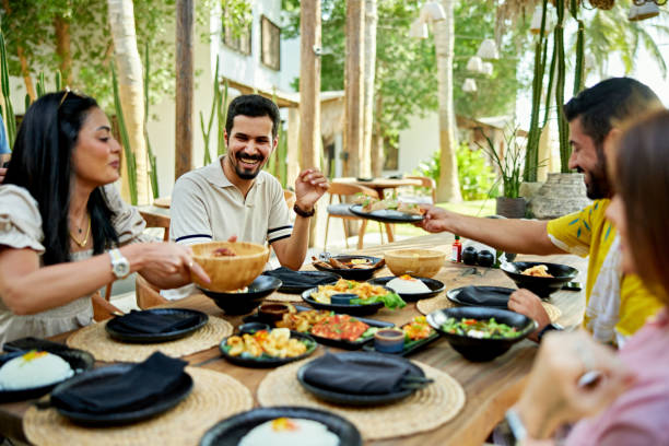 istock Happy friends enjoying lunch at resort 2157320867