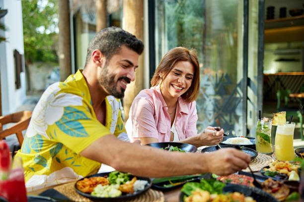 istock Happy couple having lunch at resort 2157320923