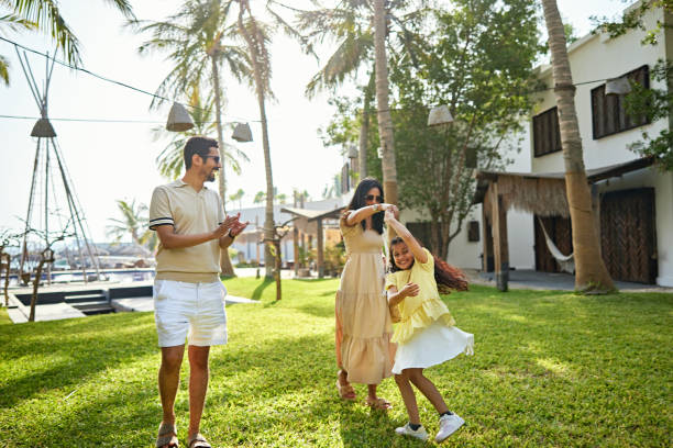 istock Family spending leisure time in resort garden 2157320964