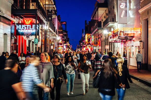 New Orleans, Louisiana, USA - Bourbon street is full of people during Mardi Gras parade.