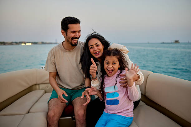 Happy family having fun during speedboat trip