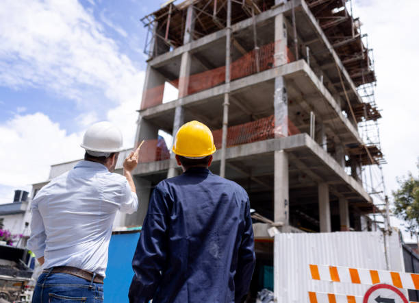 istock Architect talking to the building contractor at a construction site 2157325523