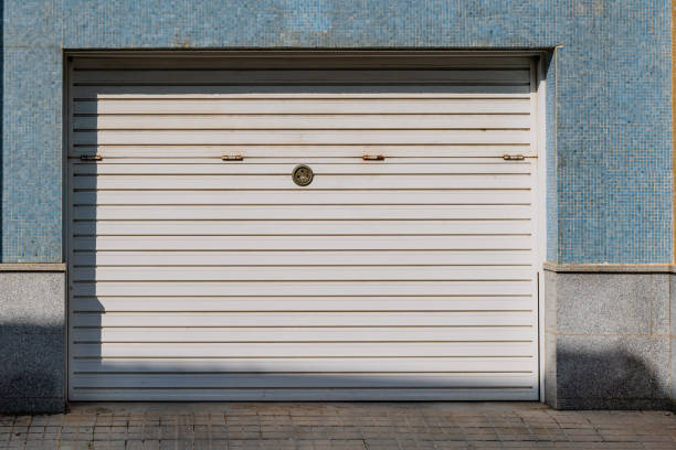Cropped photo of a white garage door on an Orange Shipping Container