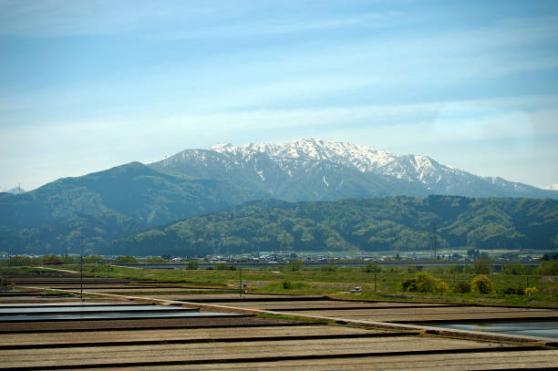 Hida Hakusan Shirakawa-go Recreation Forest and mountains of the Ryohaku mountains viewed from the Shinkansen Bullet train. Honshu, Japan’s main island with most of the country’s major cities and cultural sites. From the busy global hub of Tokyo for finance, industry, fashion and cuisine to Mount Fuji, the iconic, snow-capped volcano and the city of Kyoto, famed for Zen temples, gardens and traditional geisha entertainment