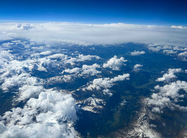 View from the airplane window to mountains. Close-up. Top view.