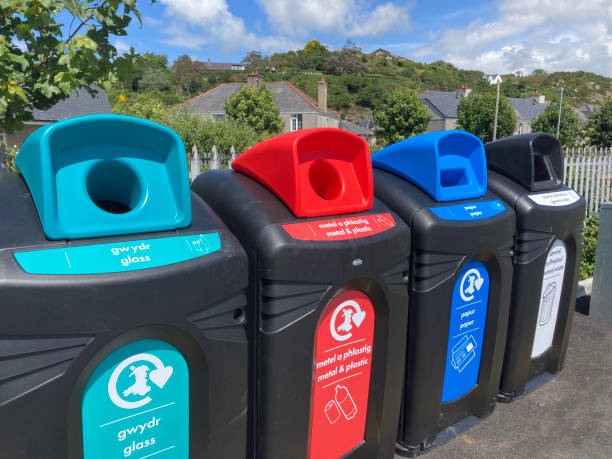 istock Recycle bins accepting a range of separated waste including paper, glass, plastics and general rubbish. Different colours to improve segregation. 2157335025