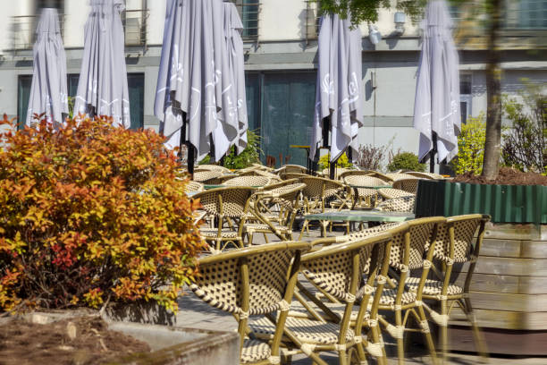 istock .Prepared outdoor cafe with tables and umbrellas 2157337868