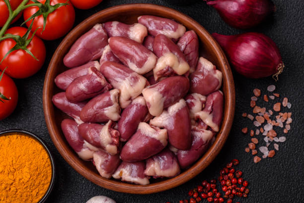 istock Raw chicken hearts with salt, spices and herbs 2157339606