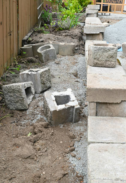 istock Rock wall construction with building block materials for terracing garden, pathways and patios 2157341074