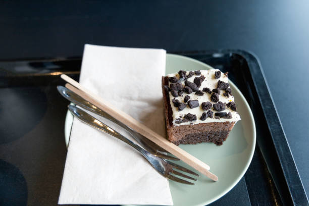 Piece of chocolate cake on a white plate in a cafe. High quality photo