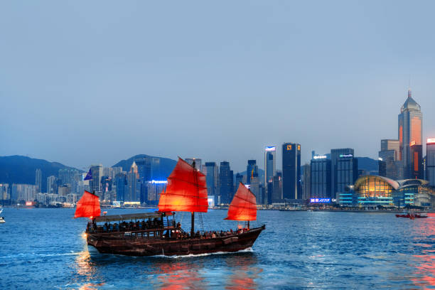 istock Traditional Junk Boat in Hong Kong Harbor During Evening 2157343421