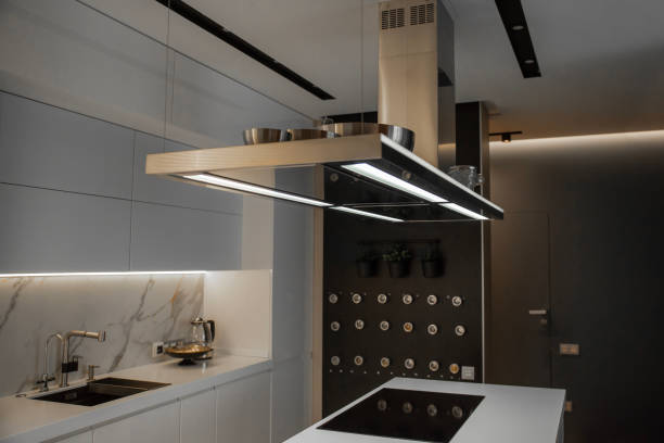 istock Steel suspended kitchen range hood on a kitchen 2157345248