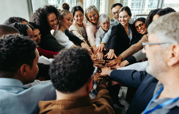 istock Diverse colleagues showing teamwork and unity during corporate teambuilding conference 2157348348