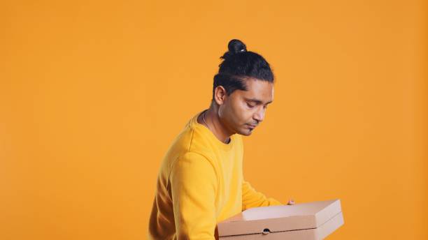 istock Food delivery service worker prepared to do delivery, studio background 2157353190
