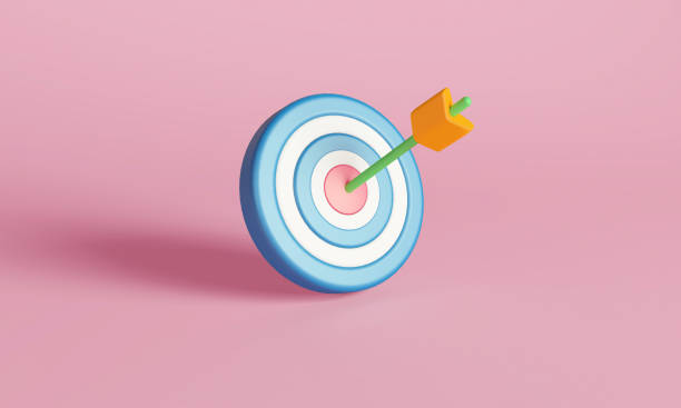 istock Arrow Hitting Bullseye on Blue Target Against Pink Background 2157353486