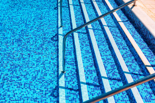 istock Swimming pool with staircase and a ladder 2157353574