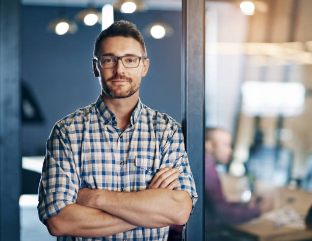 istock Portrait, business and man confident in office, designer and expert with commitment of creative project. Male person, glasses and arms crossed with pride, idea and planning for startup agency 2157354700