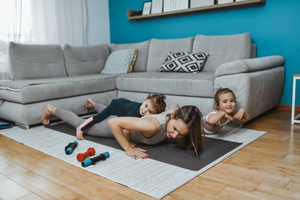 istock Home Workout By Mother And Children 2157356747