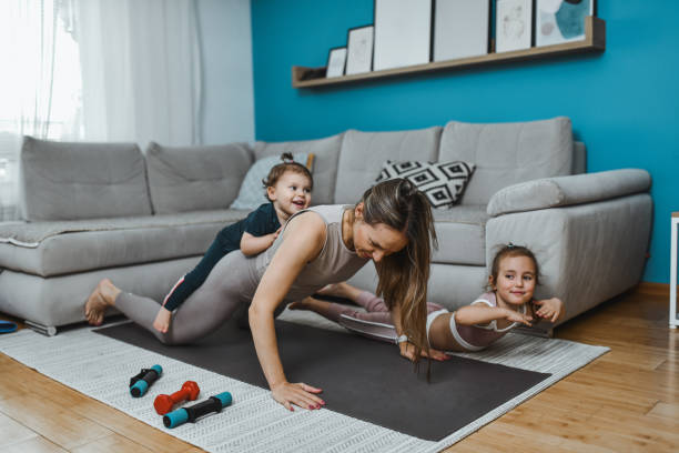 istock Tough Weight Exercises For Mother And Daughters 2157356783