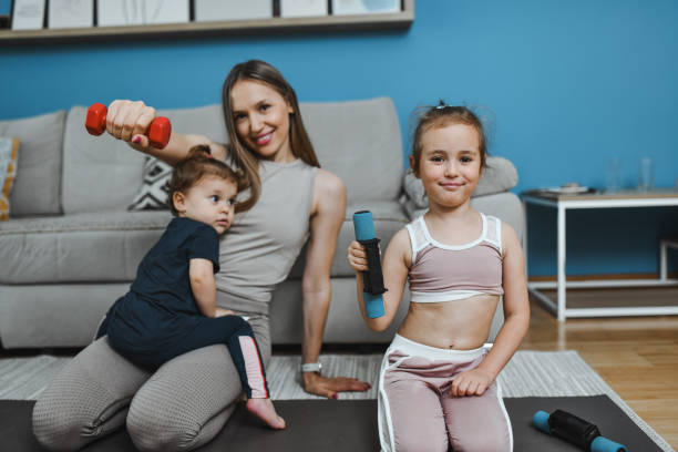 istock Sweat, Smiles And Positive Attitude For Mother Introducing Children To Workout Routine 2157356806
