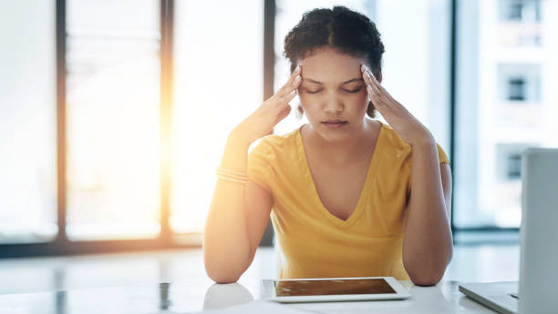 istock Stress headache, tablet and woman in office, exhausted with 404 error, pain or web problem. Frustrated, fatigue and tired girl with burnout, anxiety and deadline for time management crisis at desk 2157357110