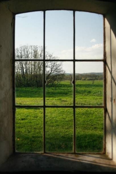 istock Rural window with the view to a field 2157362109