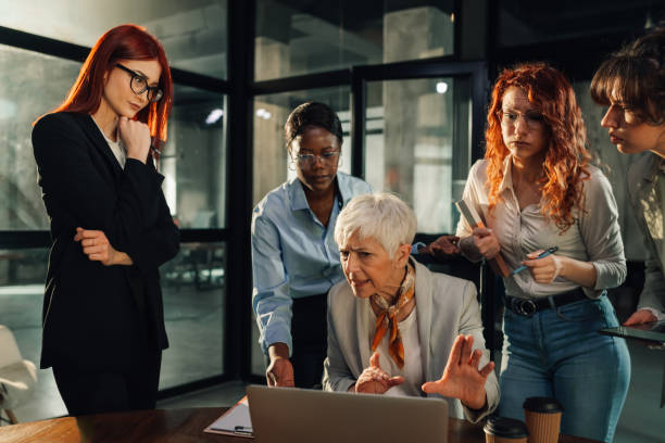 istock Nervous boss criticizing her female team while looking at the laptop. 2157364629