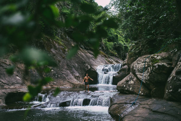 istock Man enjoying nature and waterfalls 2157364898