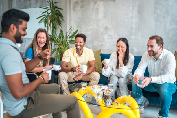 istock Colleagues Unwinding in a Stylish Office Setting 2157365548