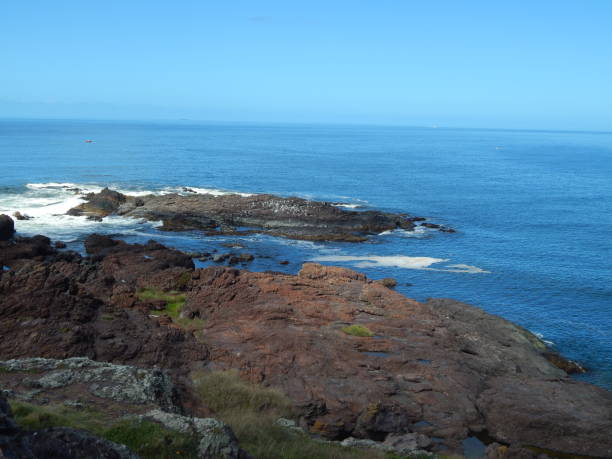 istock rocky coastline blue sea with waves splashing 2157365585