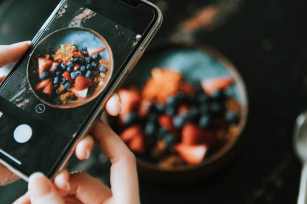 istock Blogger capturing a healthy breakfast photo to post online 2157367382