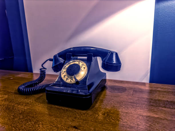 istock Close up vintage style black analog phone 2157370221