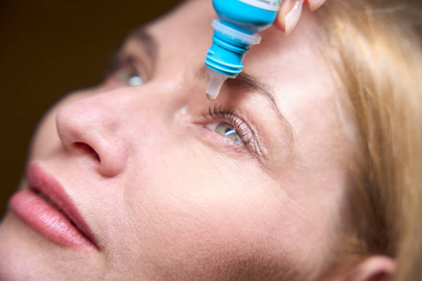 istock Woman eyes are instilled with special drops 2157371690